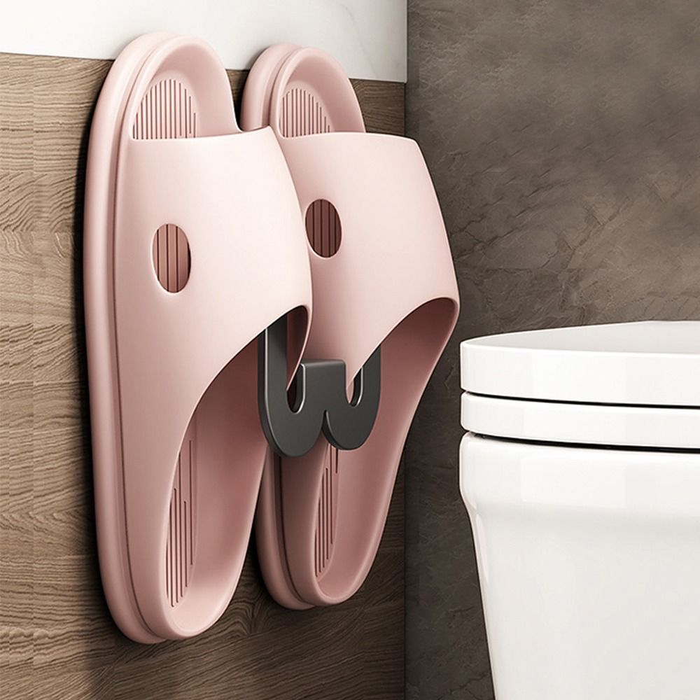 Wall-mounted bathroom slipper rack with multiple functions keeps slippers tidy and organized, saving space in your home. Perfect for hanging slippers in your bedroom or bathroom, this simple rack features storage hooks for additional convenience.