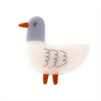 Animal-shaped acrylic duckling brooch pin with color block design is a cute fashion accessory for collars and clothing.