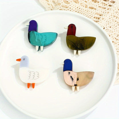 Animal-shaped acrylic duckling brooch pin with color block design is a cute fashion accessory for collars and clothing.