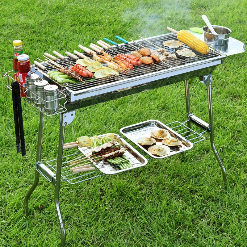 Large stainless steel barbecue grill for your household, camping, or outdoor gatherings. Features a folding design for easy portability.