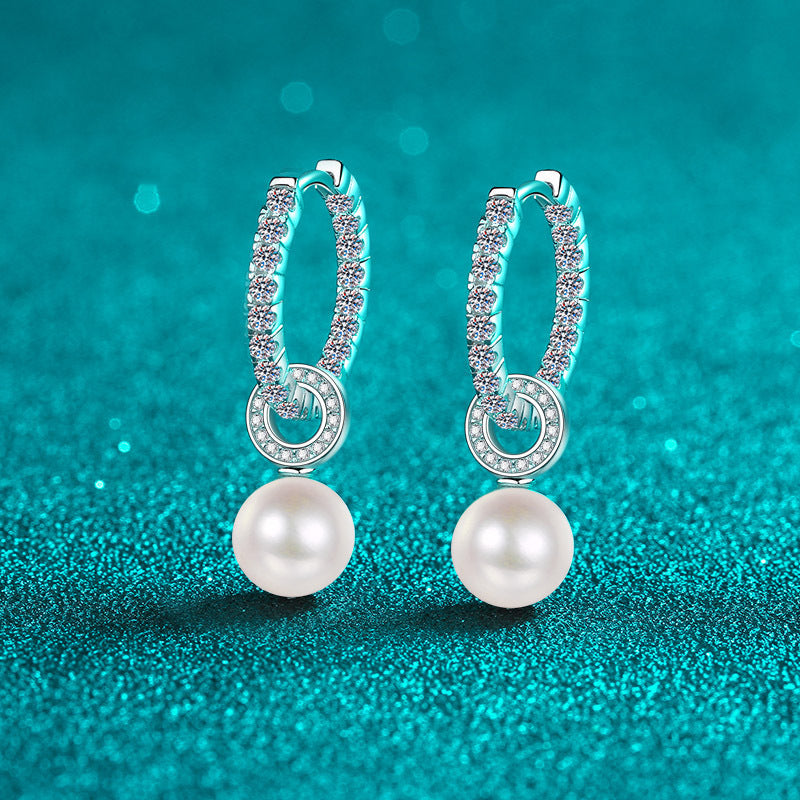 Elegant Shavano Drop Earrings featuring a 1.1 Carat Moissanite & Freshwater Pearl, crafted in 925 Sterling Silver. These earrings are perfect for weddings and gift-giving. They are inlaid with a secure clasp and weigh 4.7g.