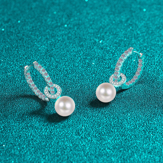 Elegant Shavano Drop Earrings featuring a 1.1 Carat Moissanite & Freshwater Pearl, crafted in 925 Sterling Silver. These earrings are perfect for weddings and gift-giving. They are inlaid with a secure clasp and weigh 4.7g.