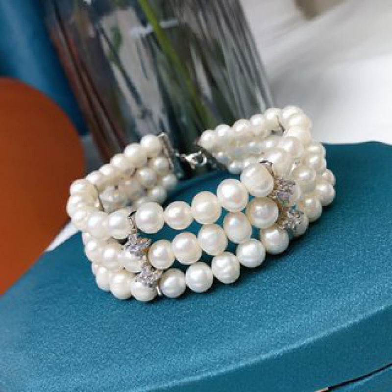 Stylish and sophisticated, this stunning multi-layer freshwater pearl bracelet is versatile for both casual outings and special occasions. It makes a perfect Mother's Day gift and is a must-have accessory in every woman's fashion collection.