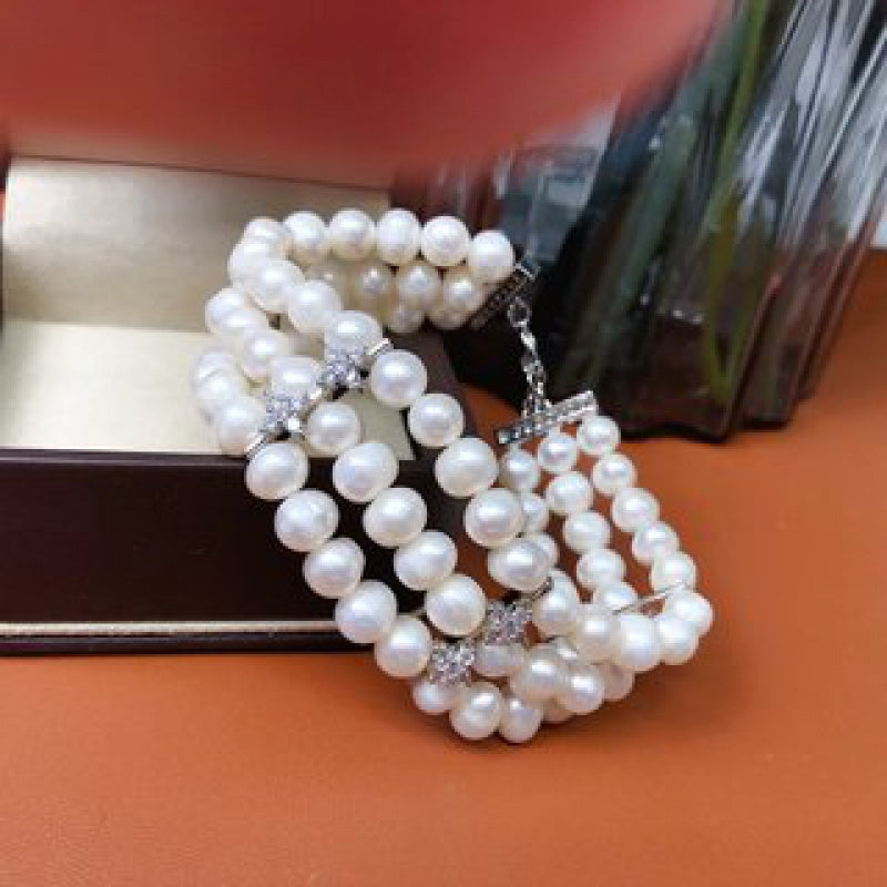 Stylish and sophisticated, this stunning multi-layer freshwater pearl bracelet is versatile for both casual outings and special occasions. It makes a perfect Mother's Day gift and is a must-have accessory in every woman's fashion collection.