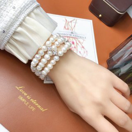 Stylish and sophisticated, this stunning multi-layer freshwater pearl bracelet is versatile for both casual outings and special occasions. It makes a perfect Mother's Day gift and is a must-have accessory in every woman's fashion collection.