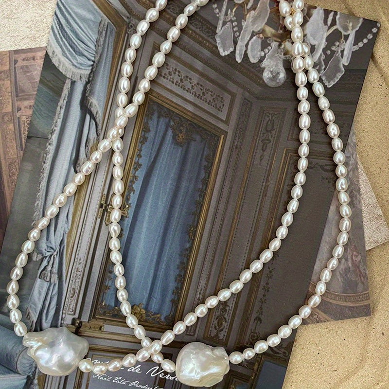 This handcrafted luxury necklace features elegant Baroque style natural freshwater pearls on an irregular clavicle chain. Each pearl has a unique storytelling quality with natural imperfections, making it perfect for daily wear or on vacation. Elevate