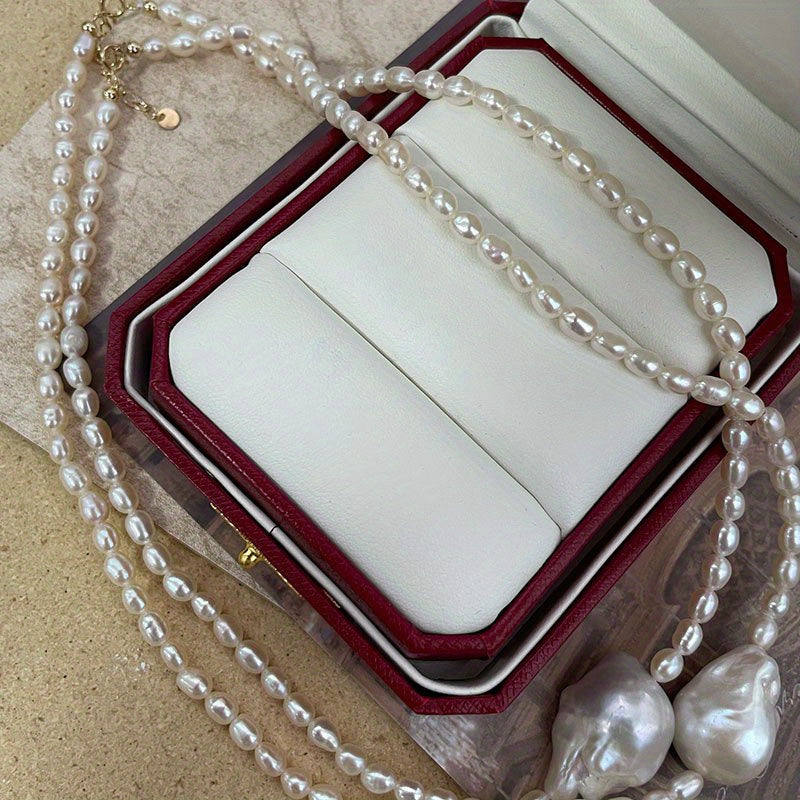 This handcrafted luxury necklace features elegant Baroque style natural freshwater pearls on an irregular clavicle chain. Each pearl has a unique storytelling quality with natural imperfections, making it perfect for daily wear or on vacation. Elevate