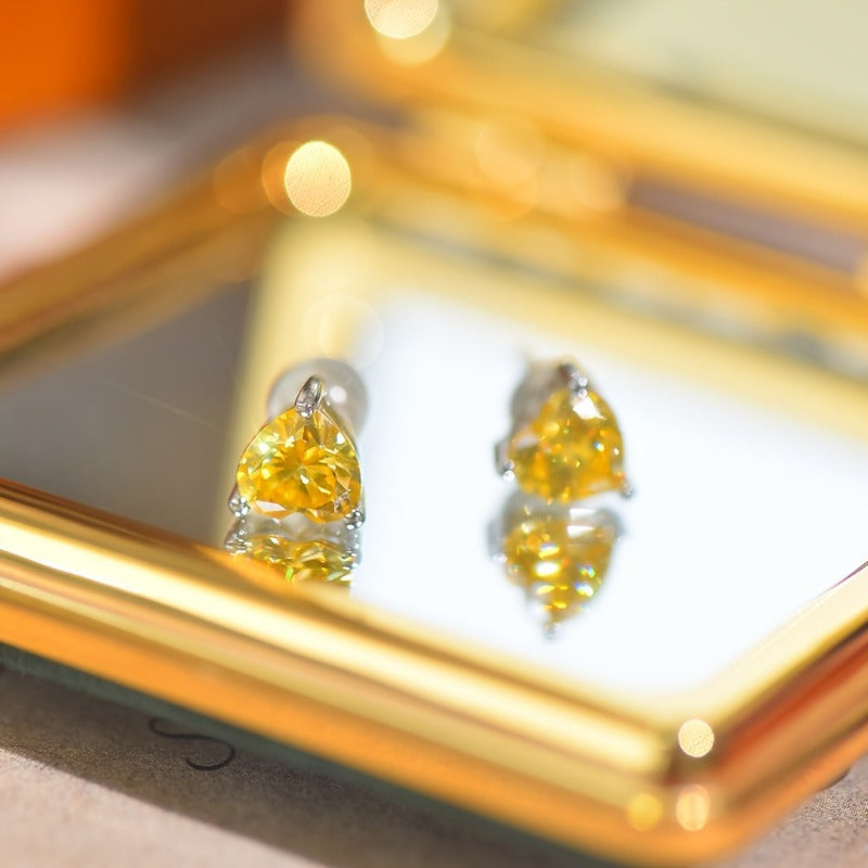 A pair of adorable heart-shaped yellow Moissanite earrings, each 1ct, perfect for celebrating Valentine's Day, Christmas, anniversaries, or birthdays.