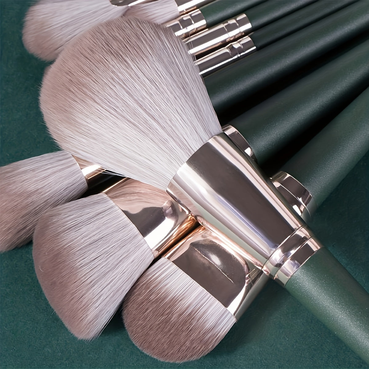 14-piece professional makeup brush set with green ABS handles and nylon brushes, suitable for normal skin.