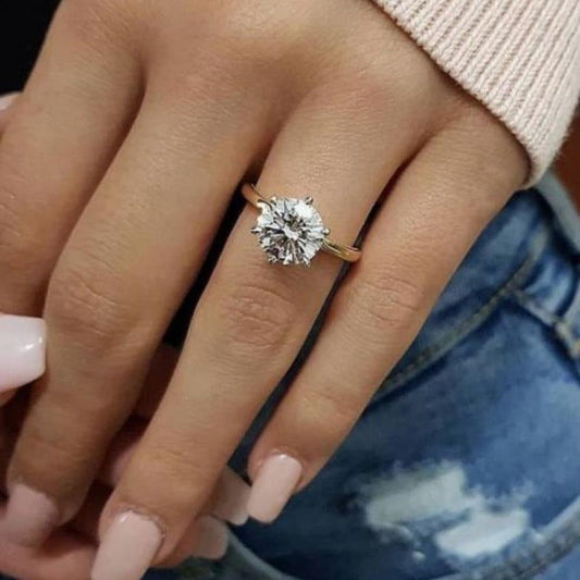 Classic Moissanite Engagement Ring in Ethic Diam Style, Made with 925 Sterling Silver and 18K Golden Plating. Perfect for Daily Wear and Gifting on Occasions like St. Patrick's Day. Available in Various Carat Options (0.5, 1, 2, 3, 5, 10).