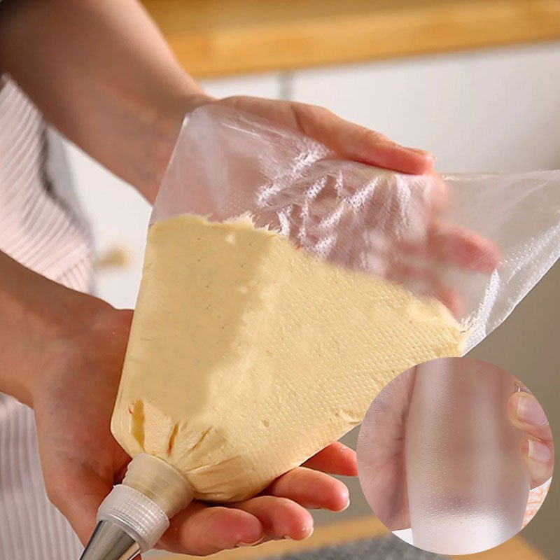 Set of 100 disposable piping bags for cake decorating, featuring triangle design for easy icing and frosting. Ideal for cookies, cupcakes, and homemade desserts. Must-have for kitchens and restaurants.