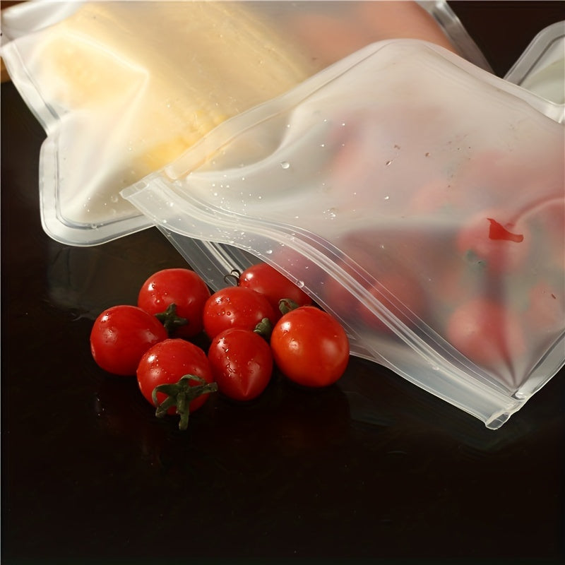 Set of 4 durable silicone food storage bags that can be reused, free of BPA and leakproof with ziplock closures. Ideal for preserving vegetables, fruits, meats, and snacks. Helps in eco-friendly kitchen organization, safe for food contact, perfect for