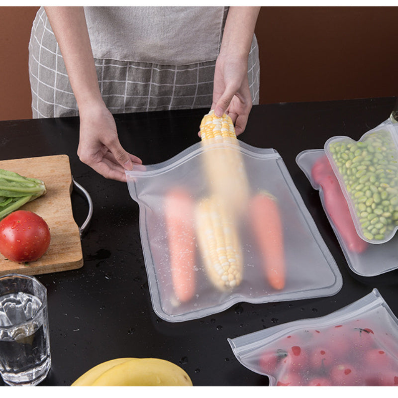 Set of 4 durable silicone food storage bags that can be reused, free of BPA and leakproof with ziplock closures. Ideal for preserving vegetables, fruits, meats, and snacks. Helps in eco-friendly kitchen organization, safe for food contact, perfect for