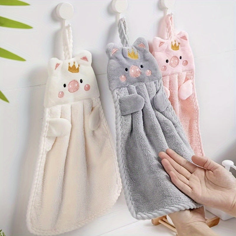 Adorable pig-themed microfiber hand towel in pink, light pink, or gray. Ultra absorbent and soft with hanging loop. Ideal for home use. Quick-drying for kitchen or bathroom.