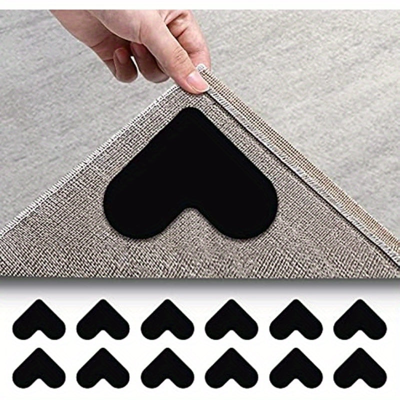 Two washable heart-shaped anti-slip rug grip tape pads, perfect for securing carpets on hardwood floors or tile. Leaves no residue and made from Polyvinyl Chloride PVC material, ideal for use in office, entryway, or bedroom.