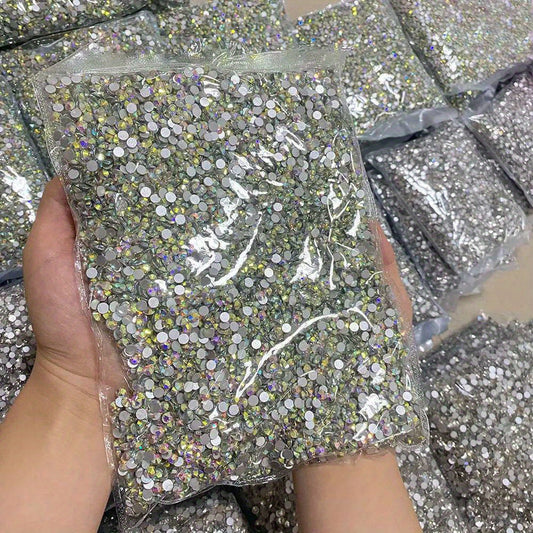 10,000 pieces of Crystal AB Flatback Rhinestones available for Nail Art, DIY Crafts, and Jewelry Making. These Non-Hotfix Resin Gems are perfect for adding a touch of sparkle to your projects.