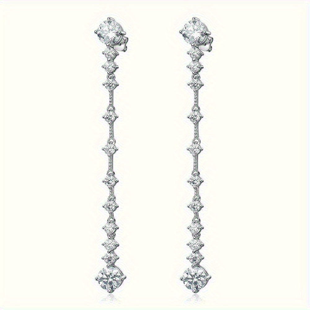 These elegant S925 sterling silver tassel earrings feature a stunning 6 carat Moissanite stone, showcasing a vintage luxury style that is perfect for occasions such as Valentine's Day, weddings, and special events. The Moissanite stone adds a touch of