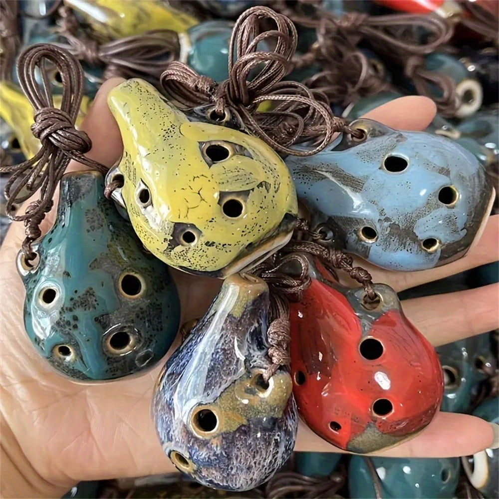 Portable ceramic ocarina flute with 6 holes, adjustable necklace, clear tone, and vibrant colors, perfect for beginners.