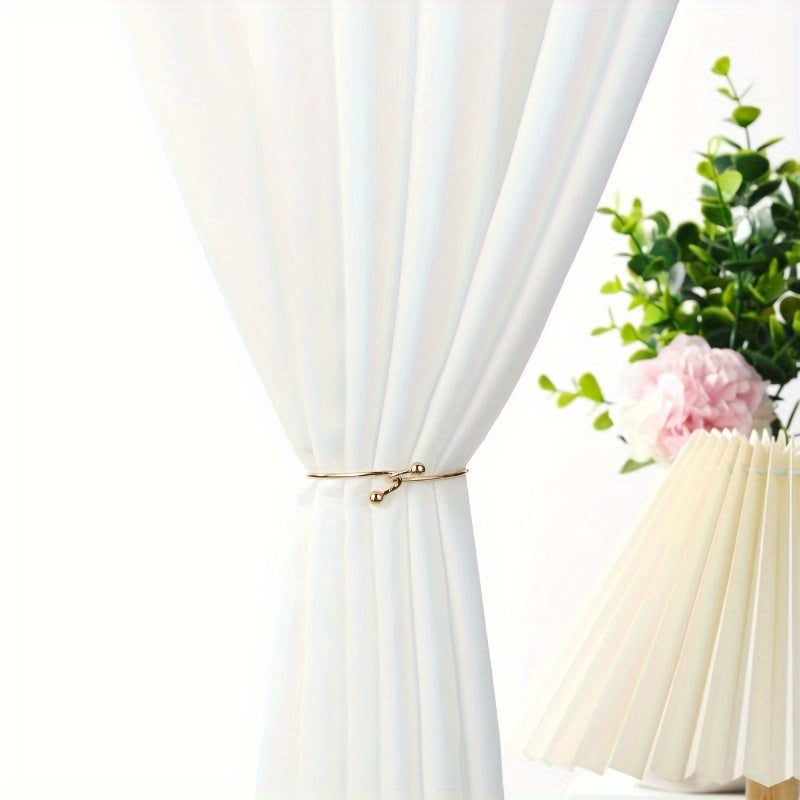 2-piece set of durable Zinc Alloy curtain holdbacks with ball finials in a classic style, perfect for adding a touch of elegance to your home or office decor.