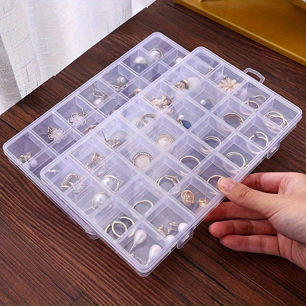 Plastic jewelry organizer box with 28 compartments for storing earrings, rings, and beads securely. Perfect for travel and home use.