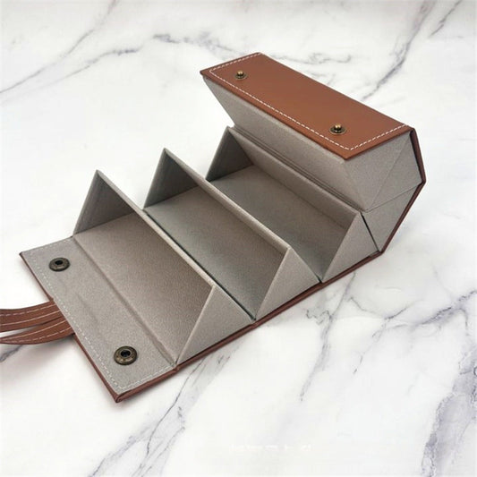 Fashionable glasses case that can be folded for easy storage, with multiple slots for display and organization while traveling. Made without alcohol.