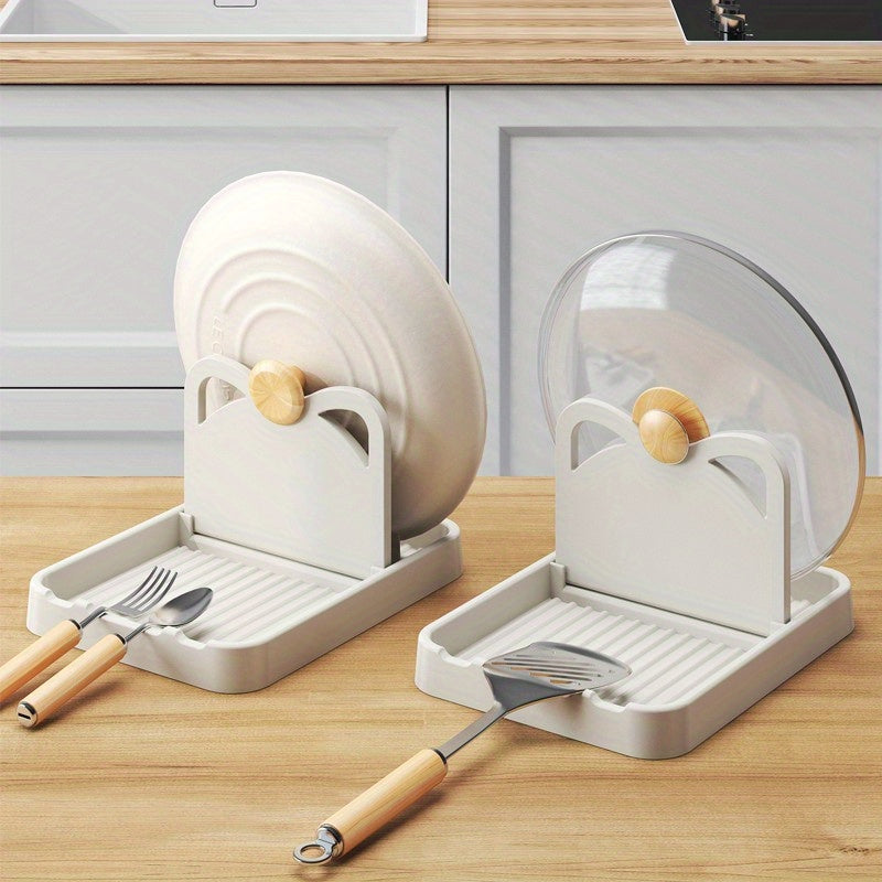 Multi-functional kitchen organizer that can hold pot lids and spoons, can be folded and mounted on the wall or placed on the countertop, made of durable plastic.