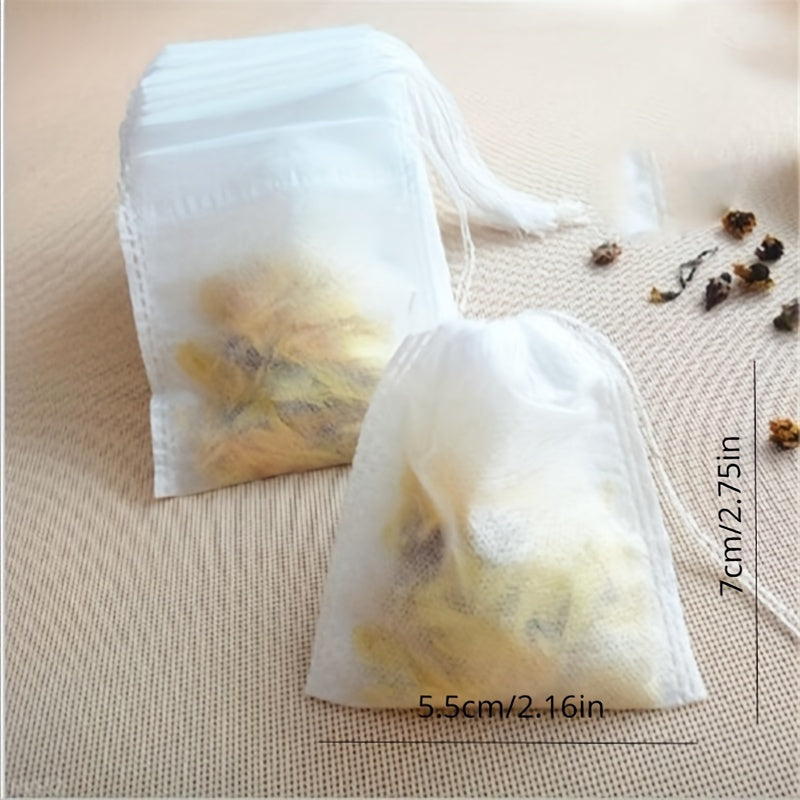 100 premium drawstring tea bags made of white non-woven fabric measuring 5.51X7.01cm, perfect for loose leaf tea, herbs, and spices.