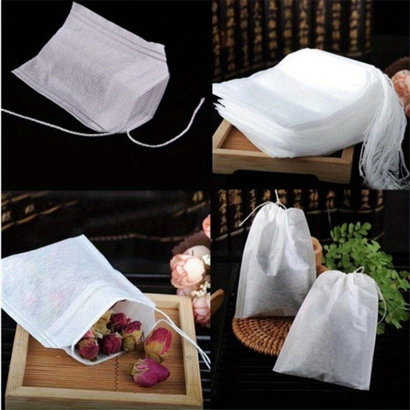 100 premium drawstring tea bags made of white non-woven fabric measuring 5.51X7.01cm, perfect for loose leaf tea, herbs, and spices.