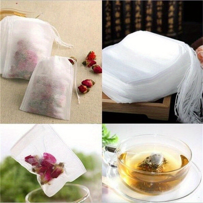 100 premium drawstring tea bags made of white non-woven fabric measuring 5.51X7.01cm, perfect for loose leaf tea, herbs, and spices.