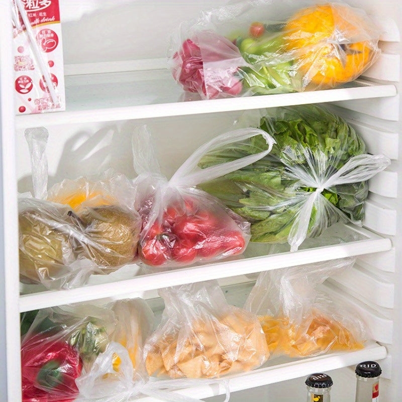 Large Refrigerator Rolling Bag with 100 pieces per roll, designed to protect and keep food fresh. This household disposable bag is thickened for durability and can be easily torn by hand. Perfect for storing vegetables, bread, and other kitchen items.