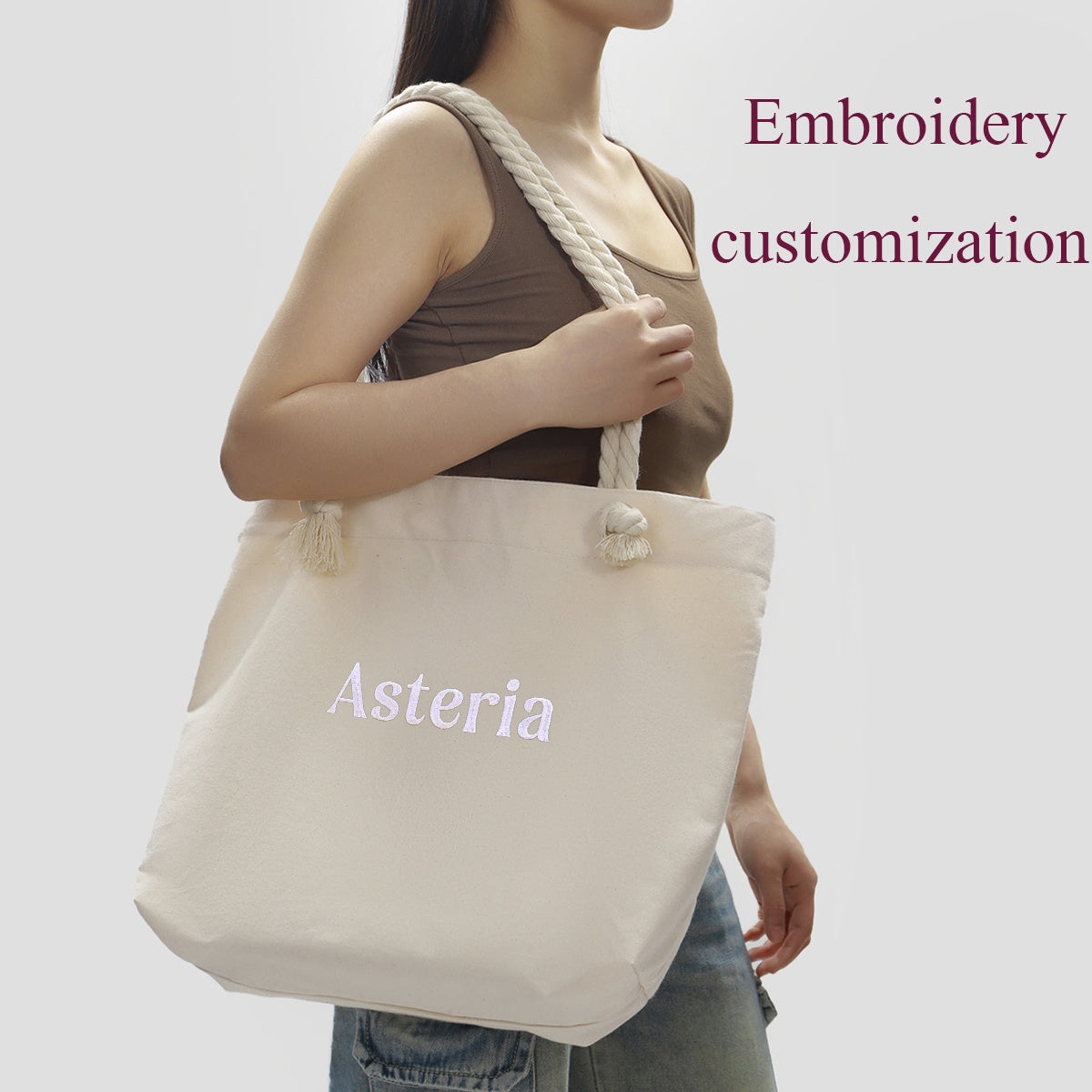 Get your own custom embroidered canvas tote bag, perfect for casual styles. This shoulder shopping bag has a large capacity and is foldable and washable for easy use. It's ideal for everyday commuting, travel, and beach trips.