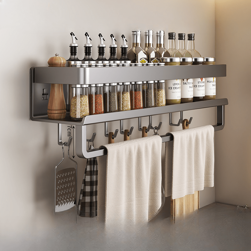 Metal storage for bathroom toiletries that does not require drilling, featuring a spice rack, utensil holder, and towel bar, all in one wall-mounted kitchen organizer.