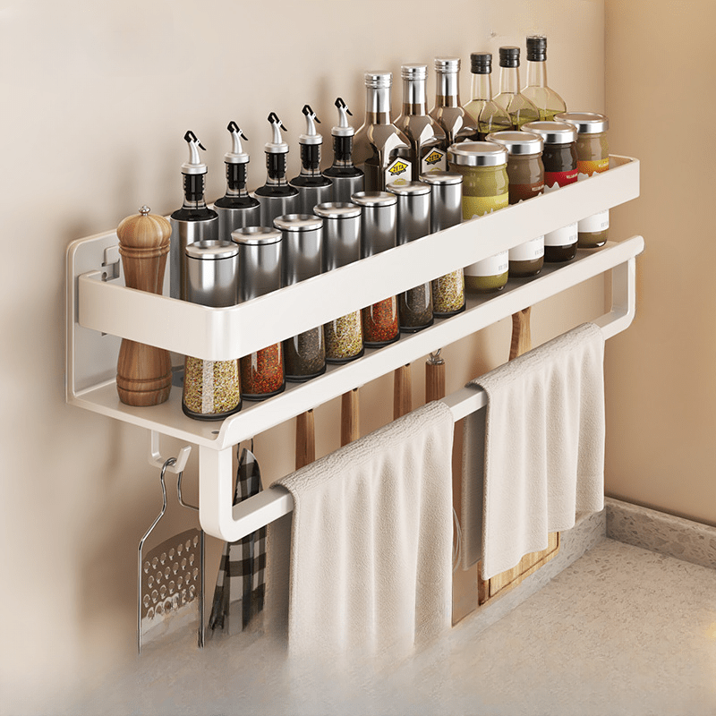 Metal storage for bathroom toiletries that does not require drilling, featuring a spice rack, utensil holder, and towel bar, all in one wall-mounted kitchen organizer.