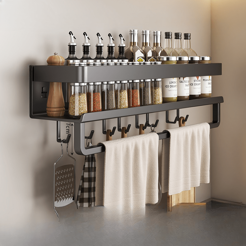 Metal storage for bathroom toiletries that does not require drilling, featuring a spice rack, utensil holder, and towel bar, all in one wall-mounted kitchen organizer.