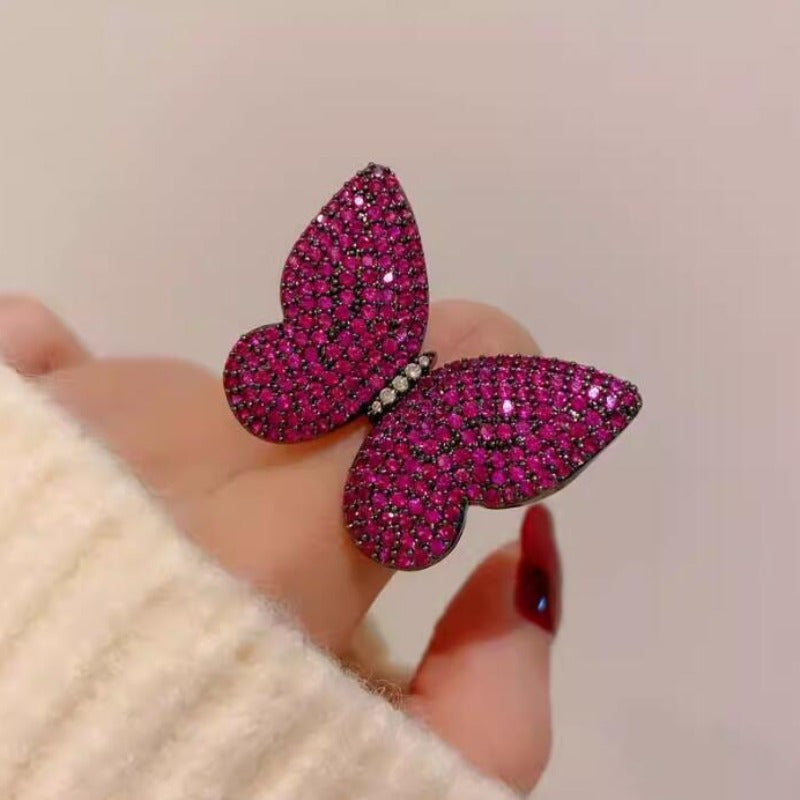 Add a touch of elegance to your outfit with this set of two stunning royal blue butterfly brooches adorned with sparkling rhinestones. This versatile and luxurious accessory is perfect for women to style in both winter and autumn seasons.