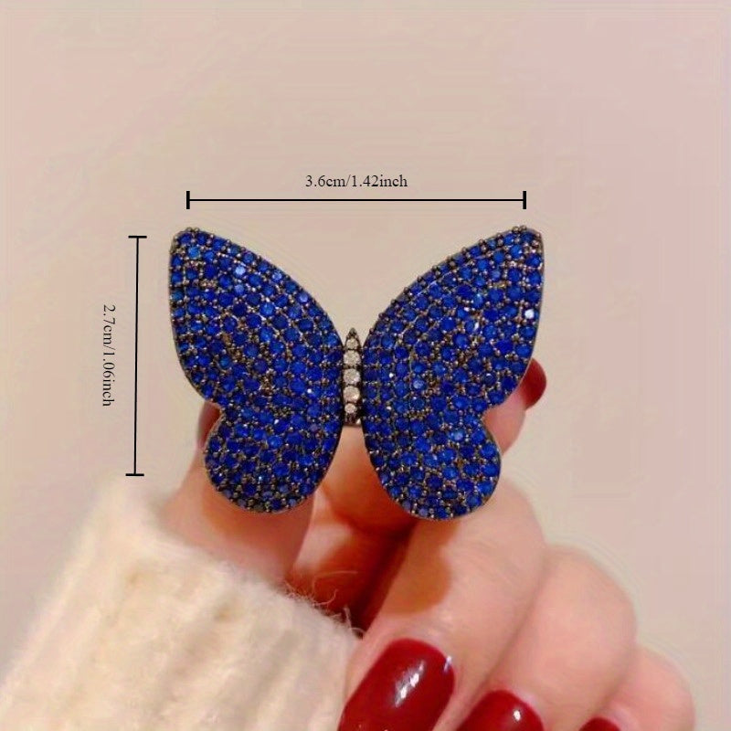 Add a touch of elegance to your outfit with this set of two stunning royal blue butterfly brooches adorned with sparkling rhinestones. This versatile and luxurious accessory is perfect for women to style in both winter and autumn seasons.