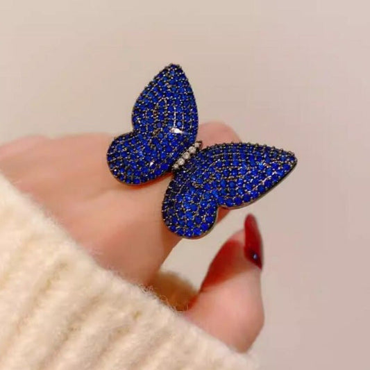 Add a touch of elegance to your outfit with this set of two stunning royal blue butterfly brooches adorned with sparkling rhinestones. This versatile and luxurious accessory is perfect for women to style in both winter and autumn seasons.