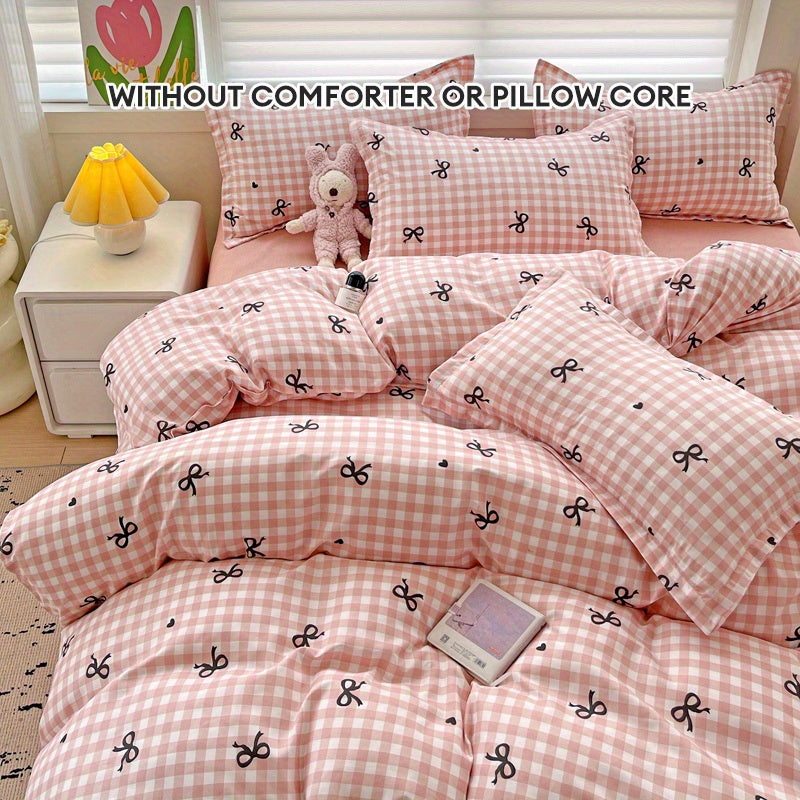 Pink plaid duvet cover set with bowknot pattern, 4 pieces - includes 1 duvet cover, 2 pillowcases, 1 flat sheet. Made of 100% polyester with zipper closure, digitally printed and