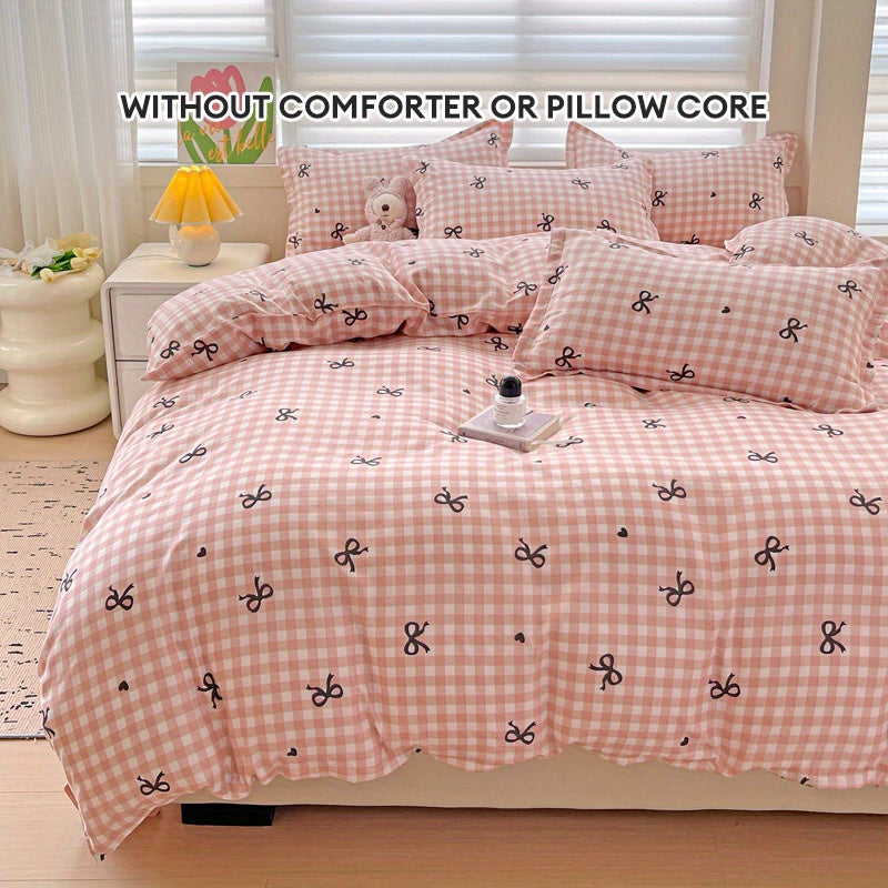 Pink plaid duvet cover set with bowknot pattern, 4 pieces - includes 1 duvet cover, 2 pillowcases, 1 flat sheet. Made of 100% polyester with zipper closure, digitally printed and