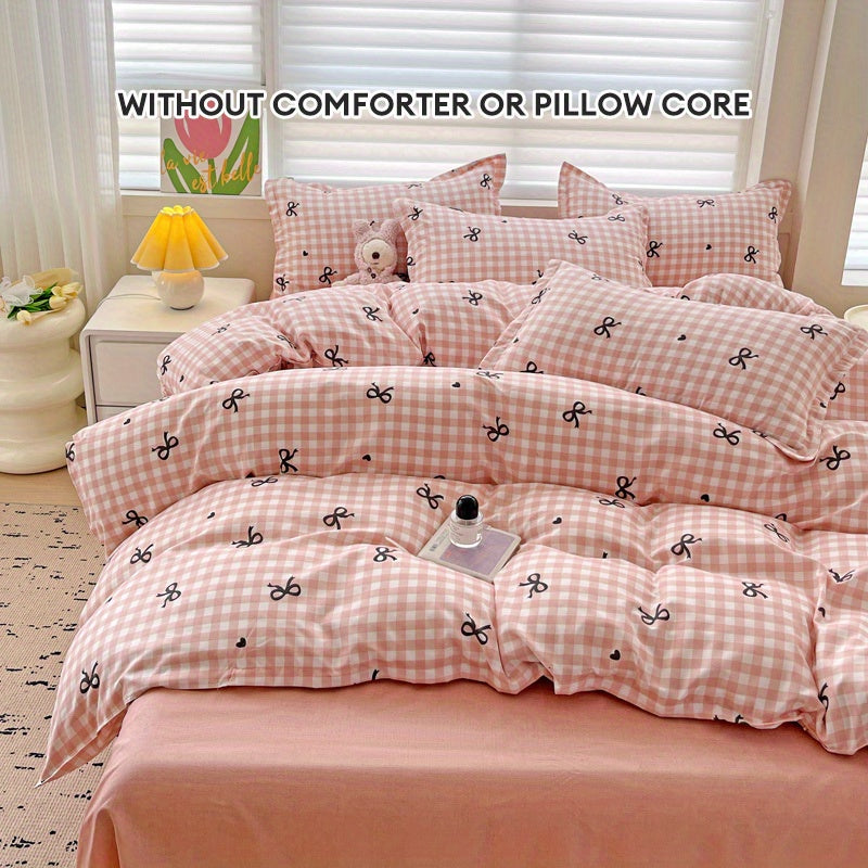 Pink plaid duvet cover set with bowknot pattern, 4 pieces - includes 1 duvet cover, 2 pillowcases, 1 flat sheet. Made of 100% polyester with zipper closure, digitally printed and