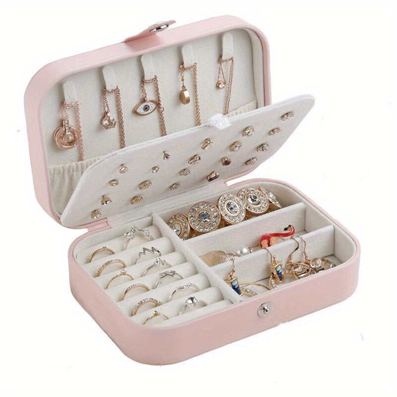 Glam style faux leather jewelry organizer box with double layer, soft lining, secure zipper closure, and textured finish. Tabletop display case for earrings, necklaces, and rings. Multipurpose desktop accessory for organization.