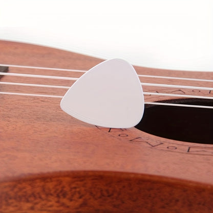 Accessories for acoustic ukuleles, basses, and electric guitars, including picks and plectrums.