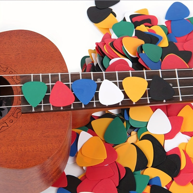 Accessories for acoustic ukuleles, basses, and electric guitars, including picks and plectrums.