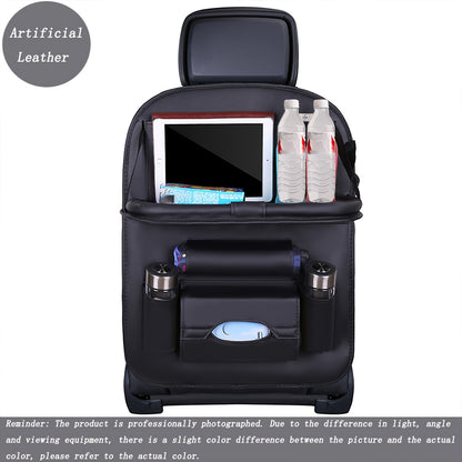 Car backseat organizer with foldable table tray made of premium PU leather for storing snacks, beverages, and entertainment items.