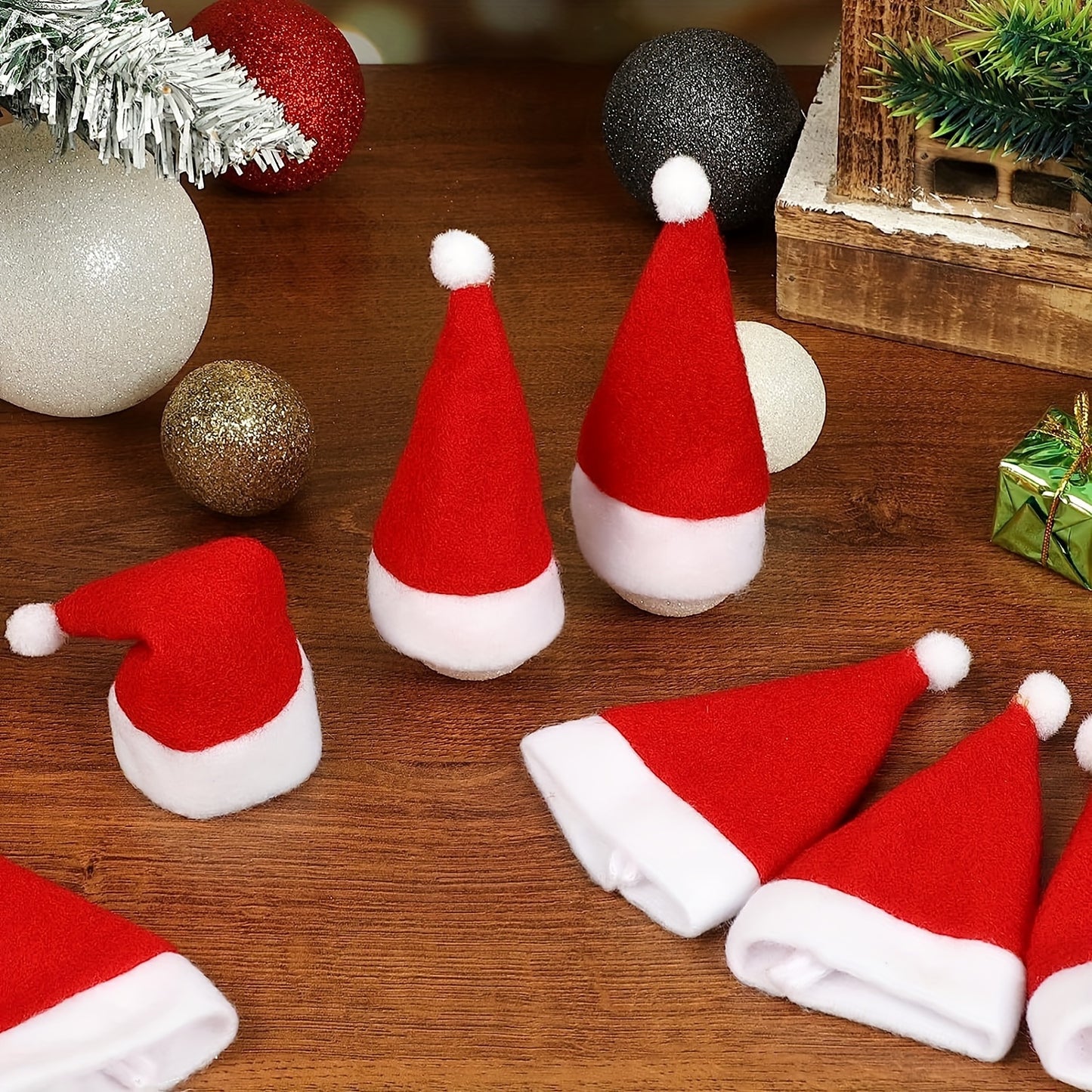 Set of 10 mini Christmas hat cutlery holders in red, ideal for holiday table decor and all-season dining.