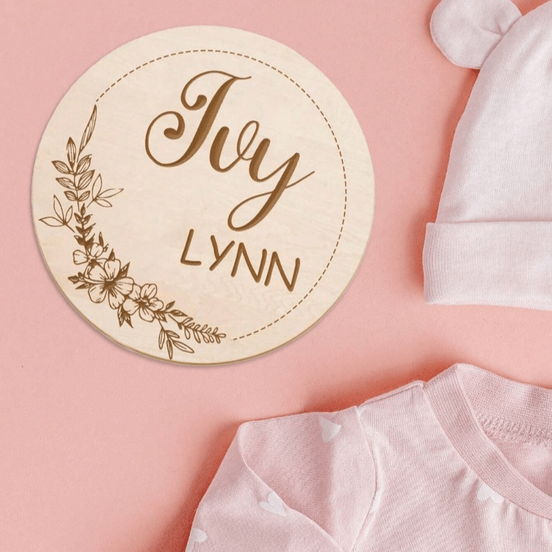 Customize your nursery decor with a personalized wooden name sign! This round plaque can be customized with a footprint and makes for a unique shower gift or photo prop.