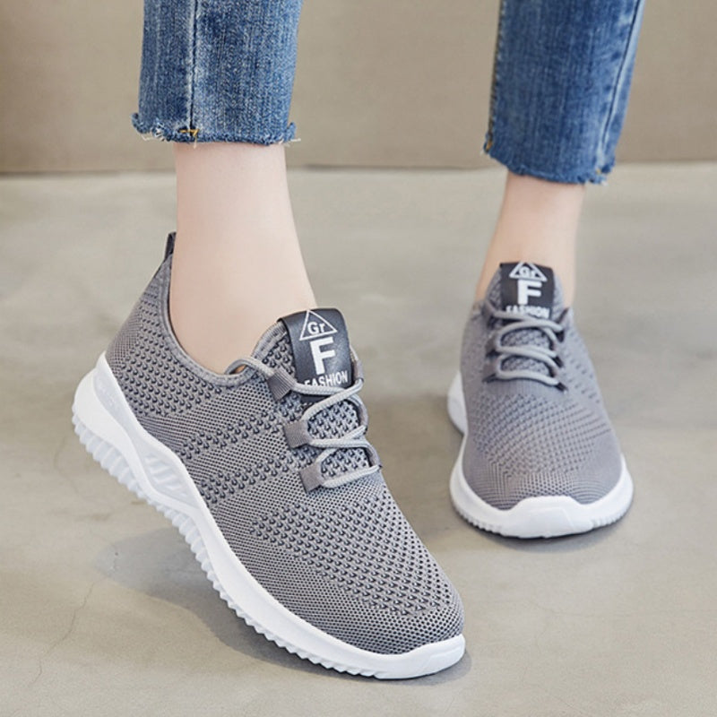 One pair of lightweight, breathable women's sports shoes suitable for vacations.