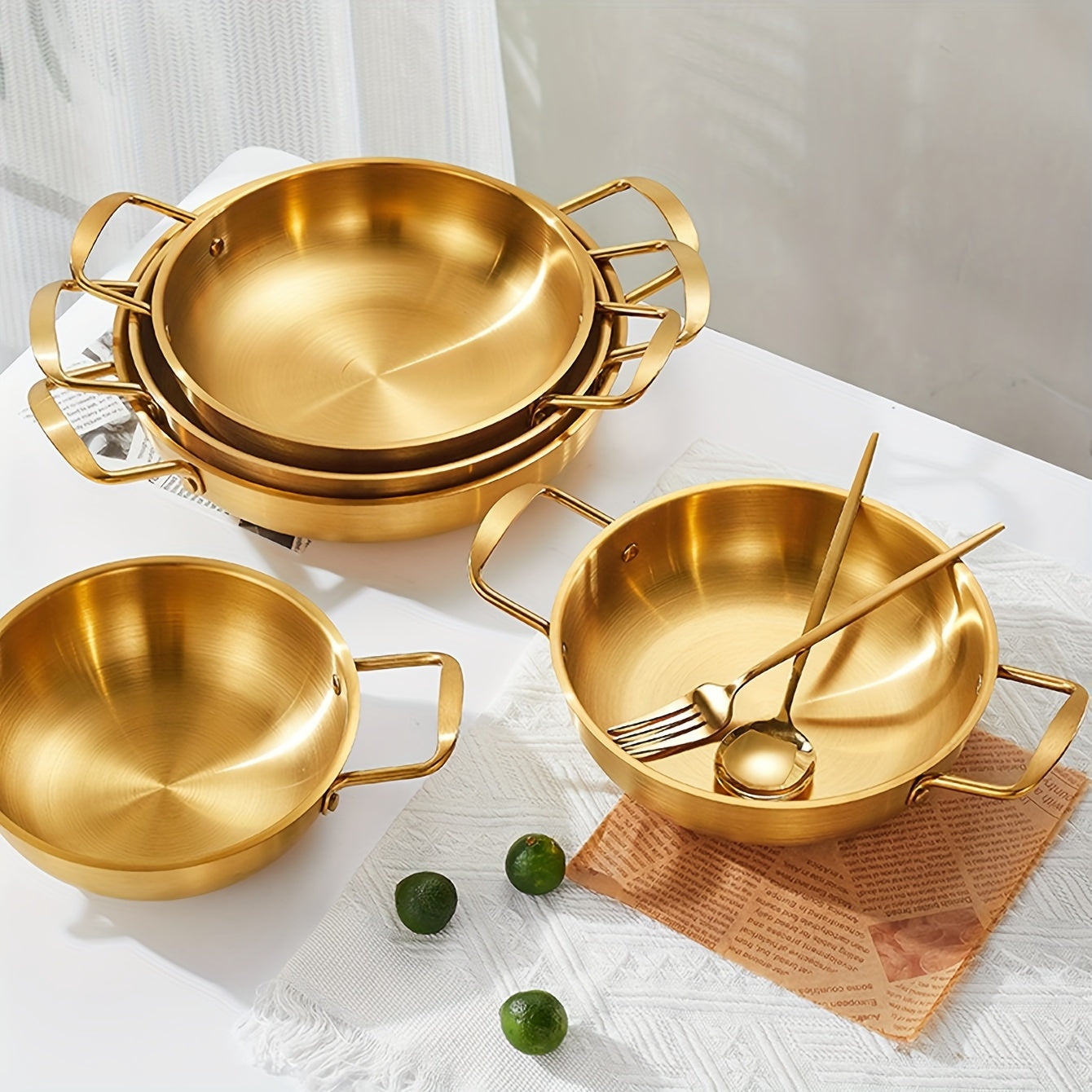 Kitchen cooking noodle pot made of 1 piece stainless steel with a golden thread design.