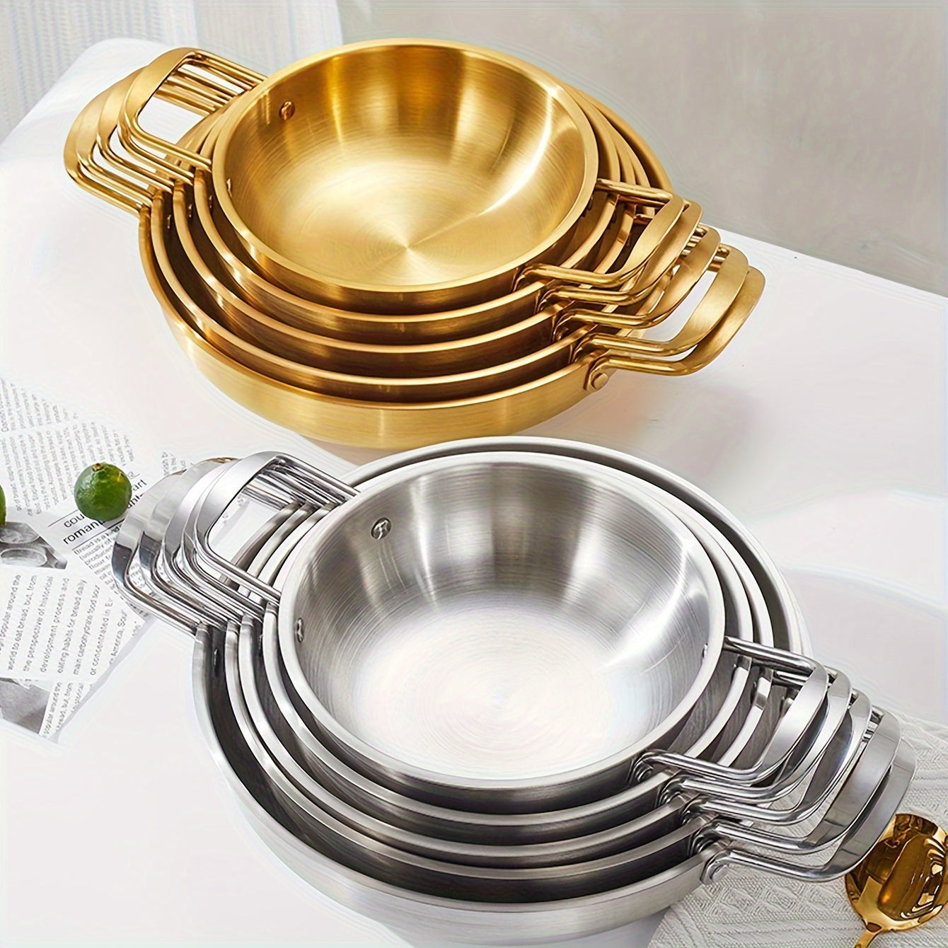 Kitchen cooking noodle pot made of 1 piece stainless steel with a golden thread design.