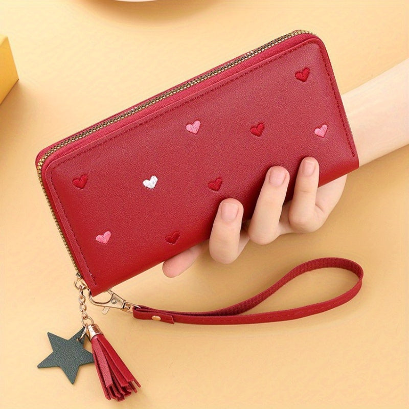 Heart and star embroidered tassel wallet with Korean style, zip-around coin purse. Ideal gift for special occasions. Embroidered clutch in faux leather material.